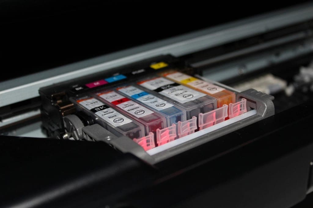 Colour ink cartridges installed inside an inkjet printer